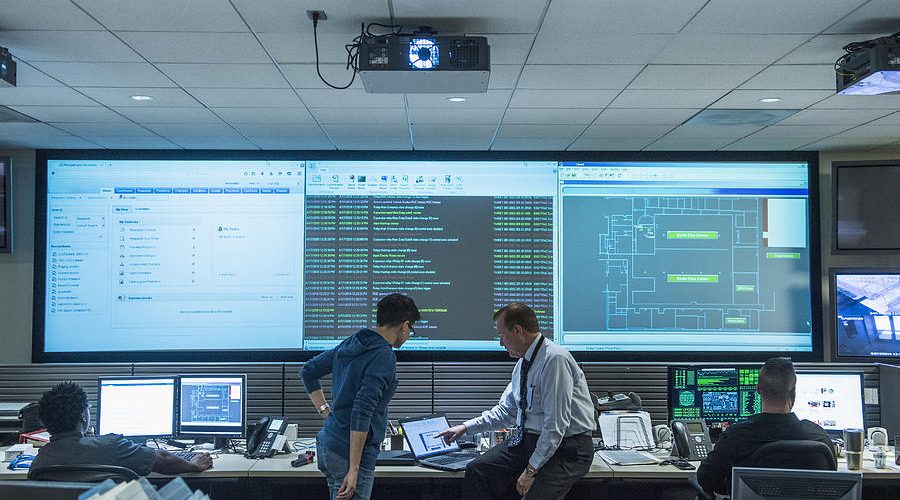 SIEM dashboard with security alerts and logs.