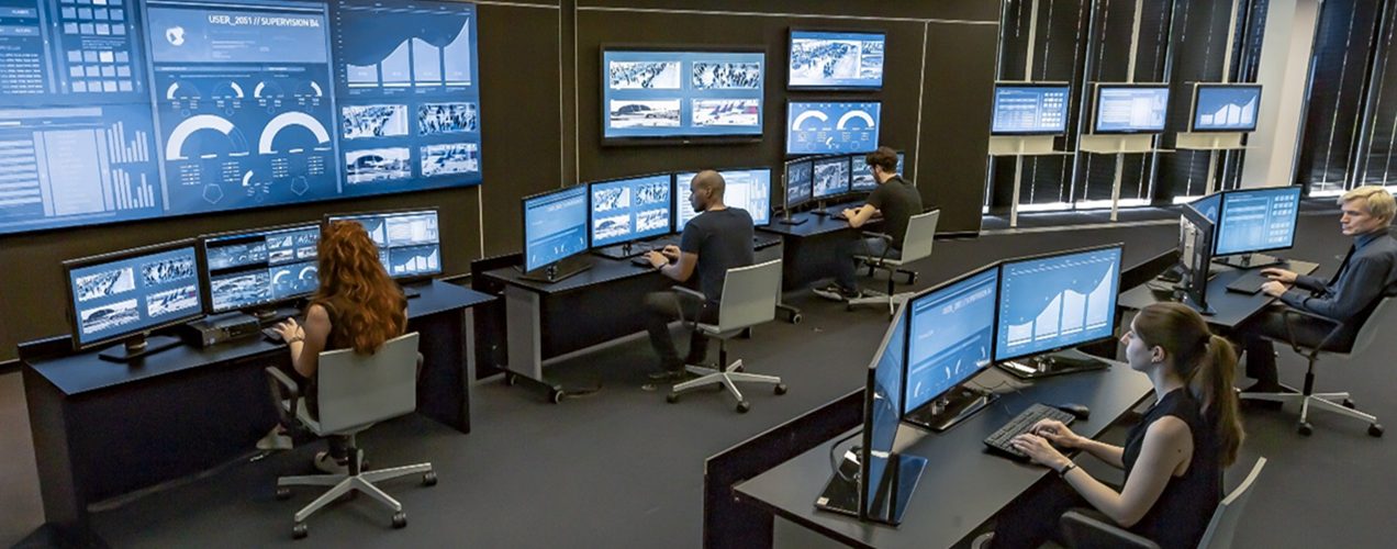 Security analysts working in a modern Security Operations Center (SOC).