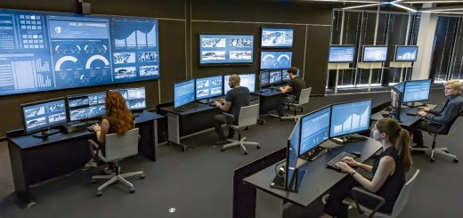 Security analysts working in a modern Security Operations Center (SOC).